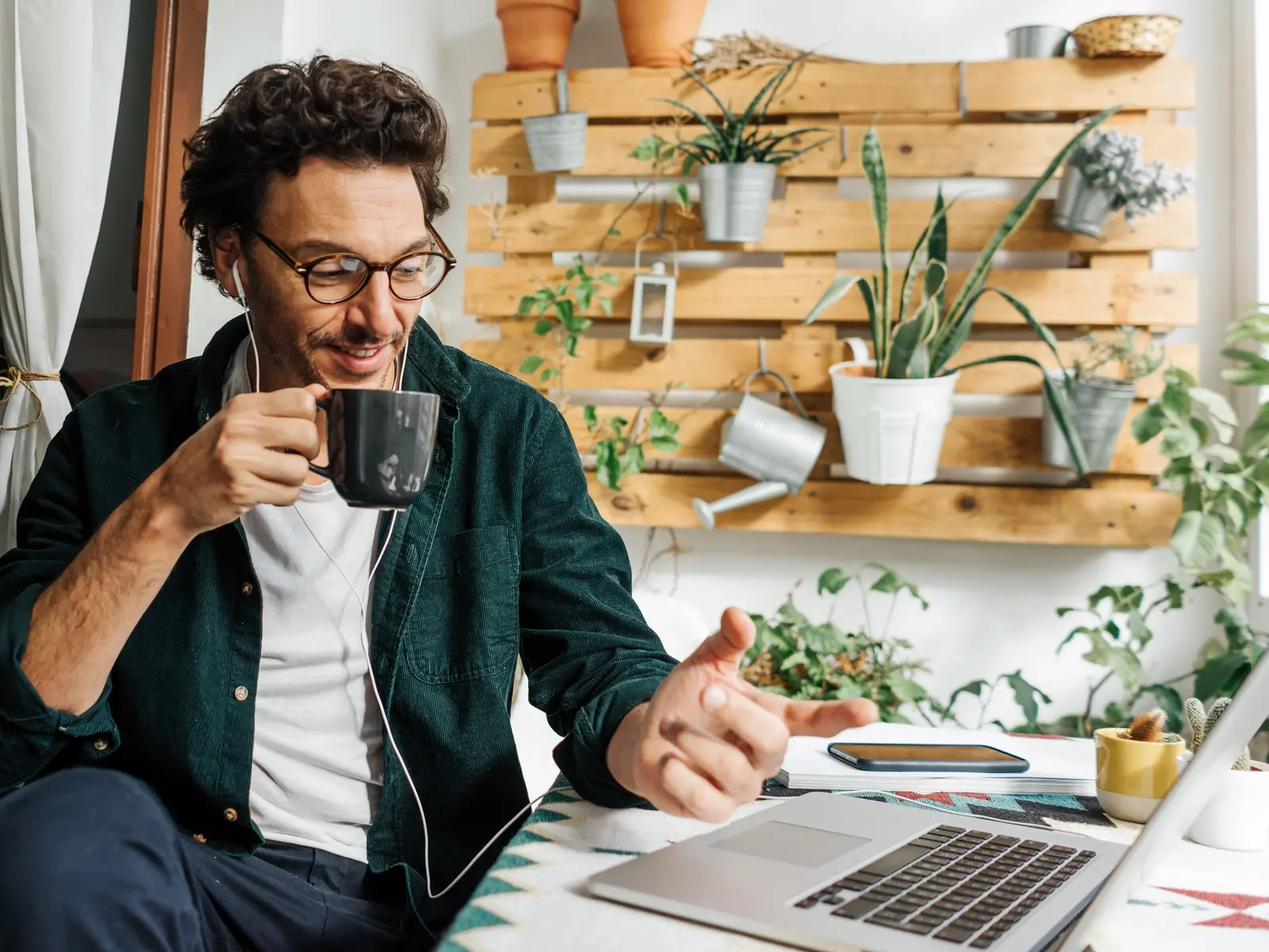 A man sits at his laptop wondering how to manage stress at work