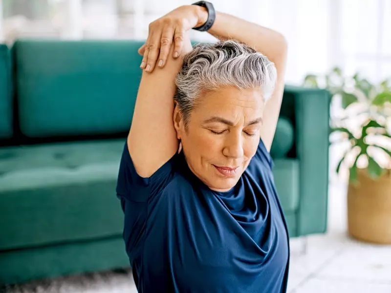 Patient stretching out their frozen shoulder