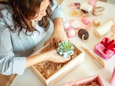 A woman builds a healthy burr basket to gift to someone interested in wellness