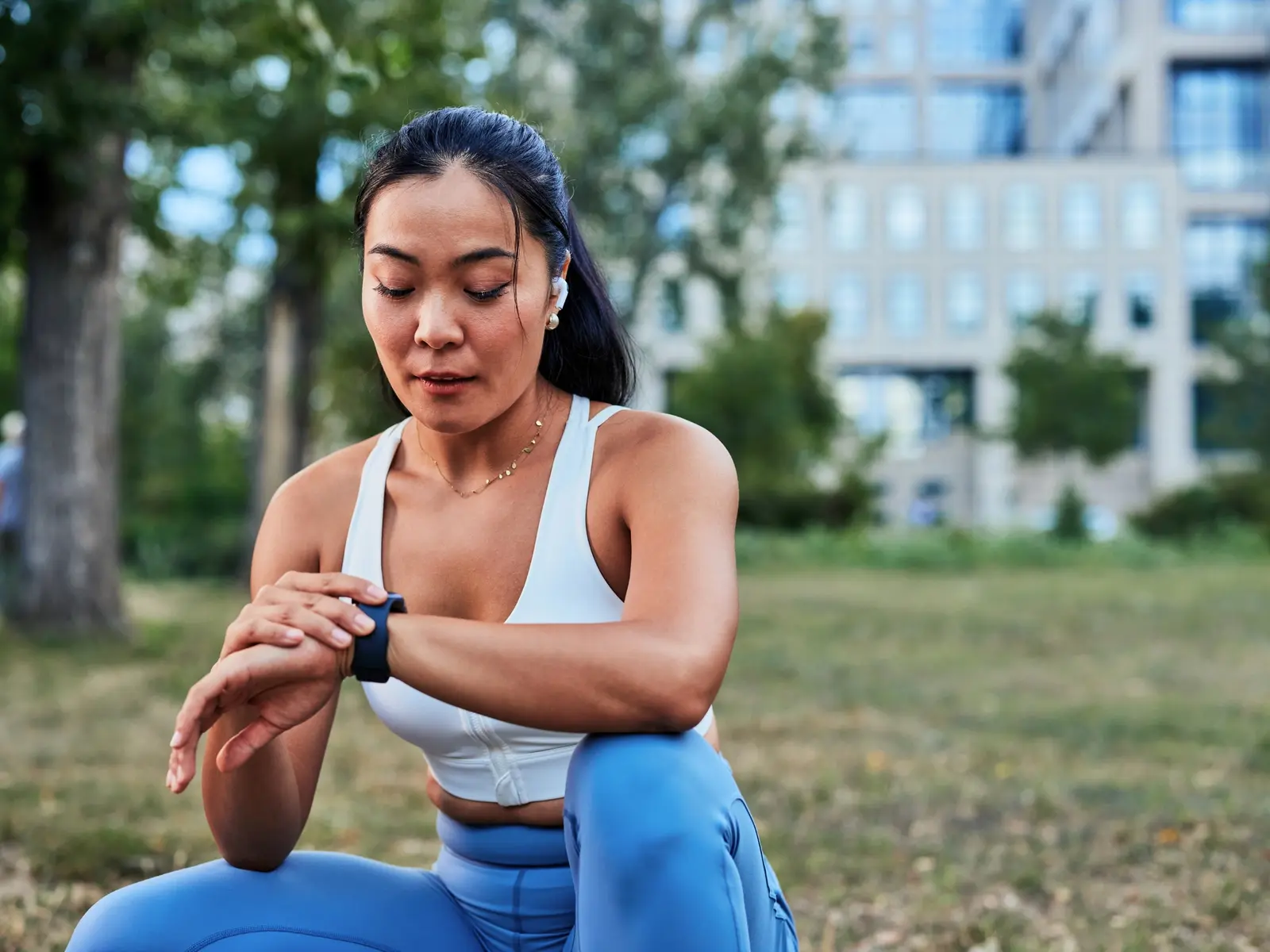 A woman checks her smartwatch after a workout asking, what is HRV?