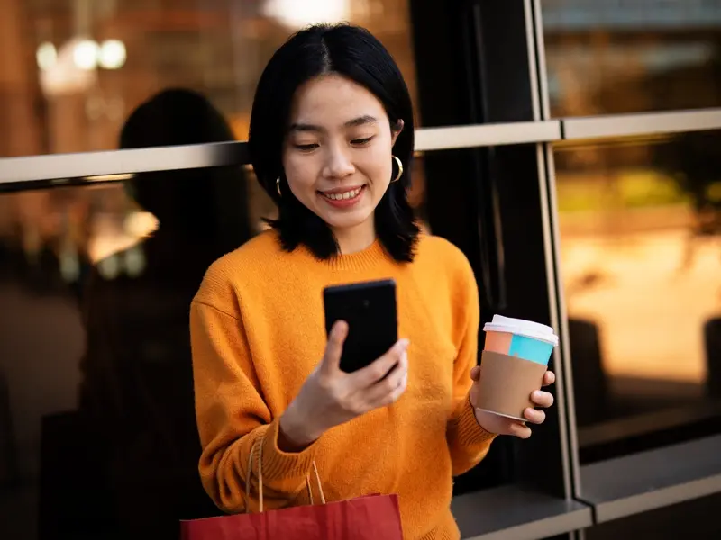 texting and coffee on the go