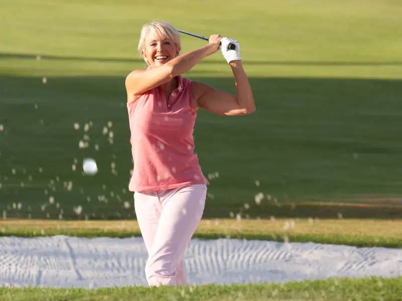 Elderly woman enjoying a round of golf on a warm, sunny day while managing congestive heart failure