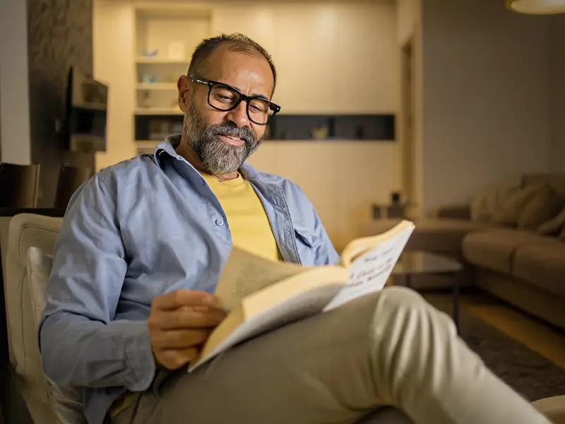 Portrait of a man reading a book