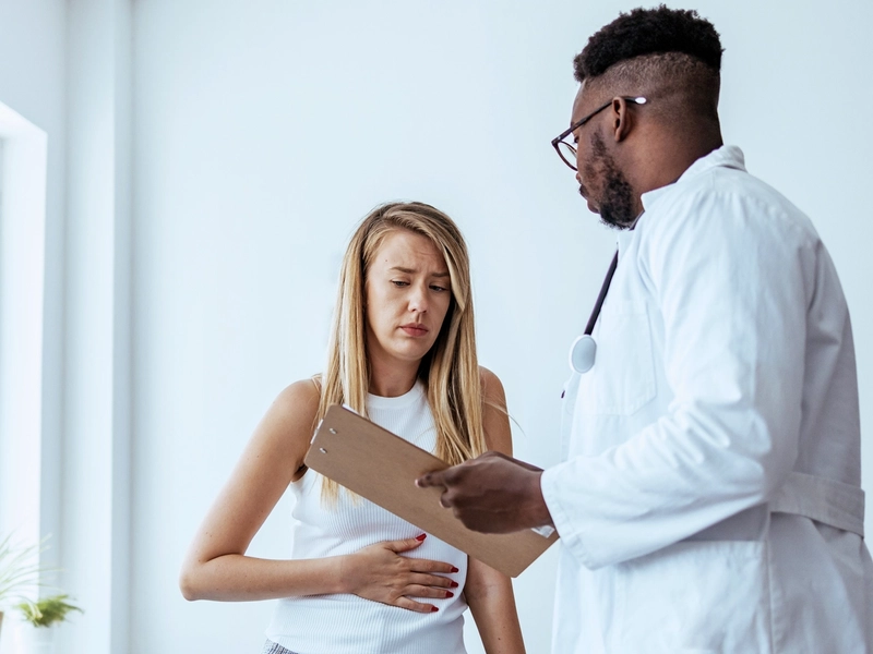 Women talking to doctor