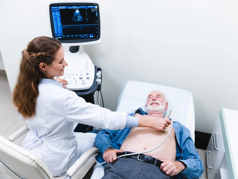 Patient receiving a vascular ultrasound in a hospital room