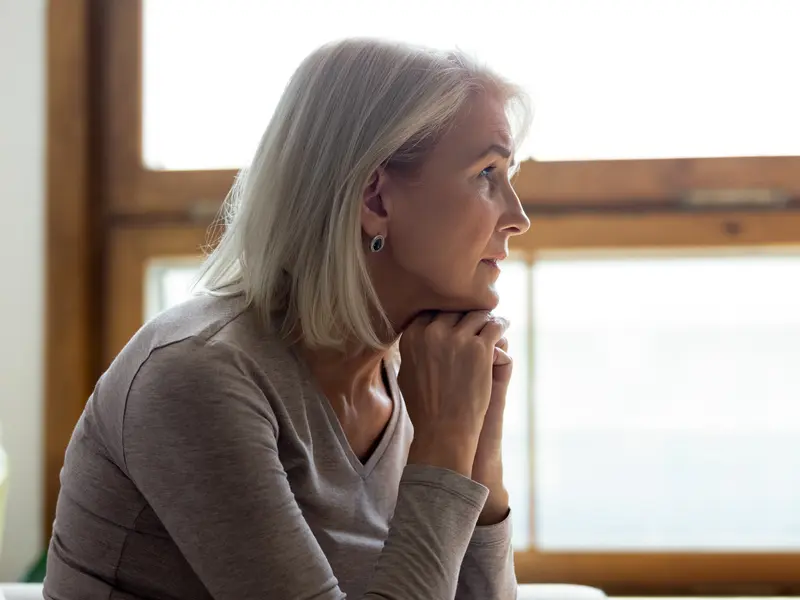 woman sitting indoors learning about the different types of lung cancer