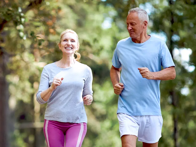 couple running outside on warm sunny day after