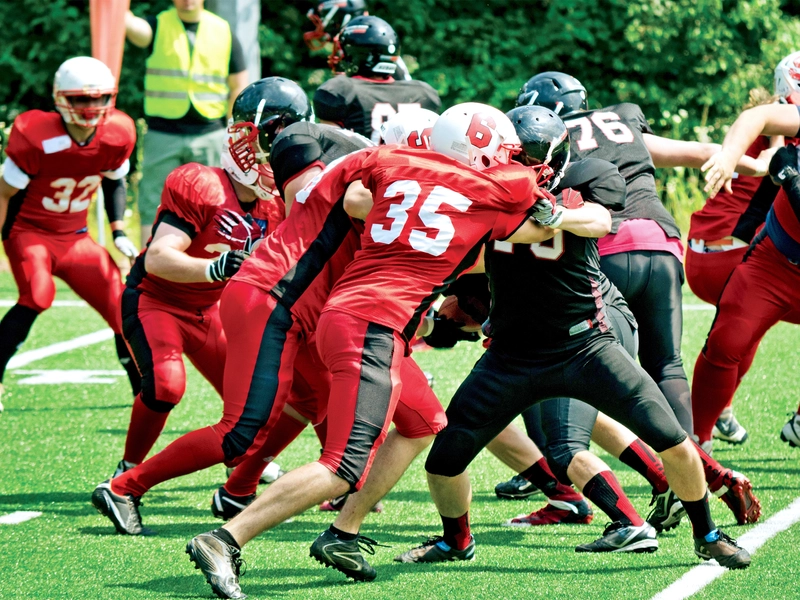 football players outside playing at high risk for concussions in need of treatment