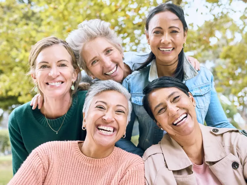 Group of women smiling after completing their health screenings