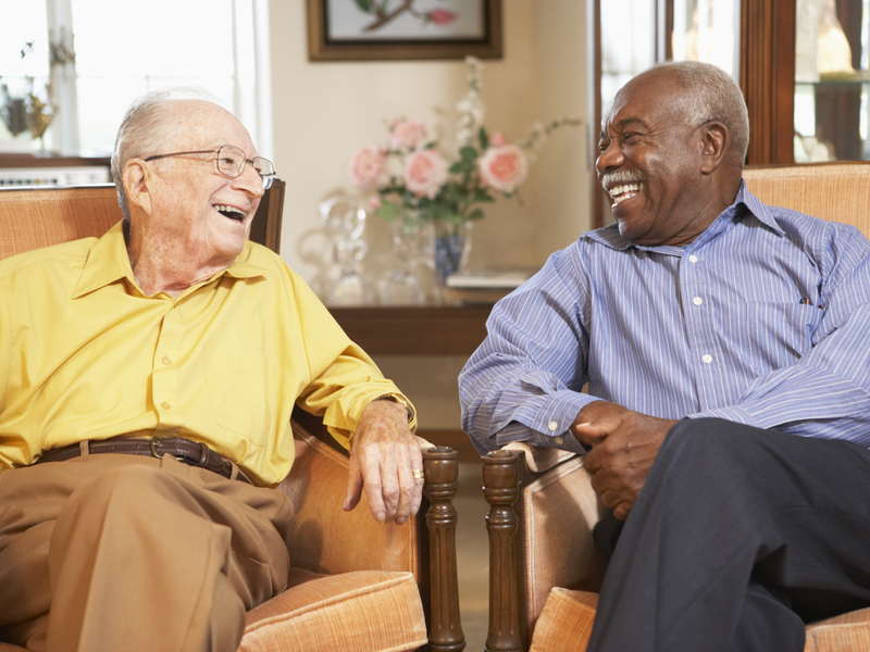 Two elderly gentlemen enjoying a laugh