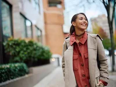 A woman taking a walk outside as part of her PCOS self care routine