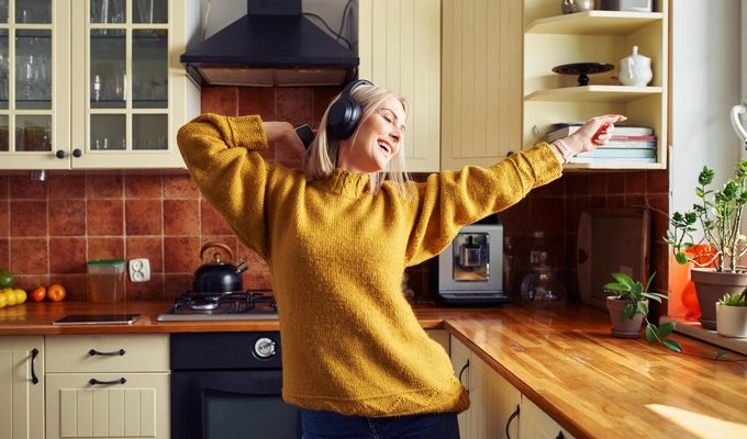 woman dancing while listening to music