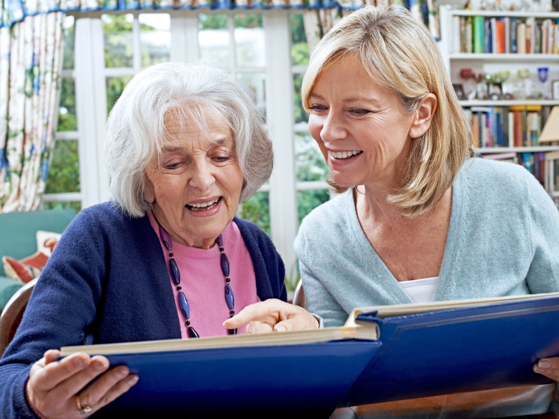 caregiver giving support to an older patient