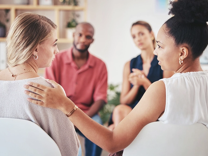 Group of patients sitting for a therapy session