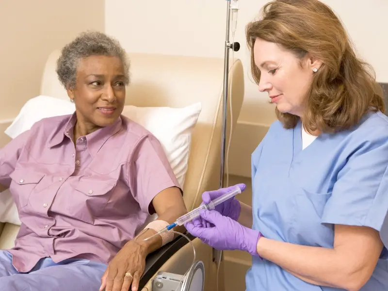 patient receiving an injection of monoclonal antibodies