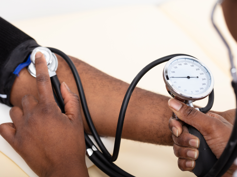 patient having their blood pressure taken