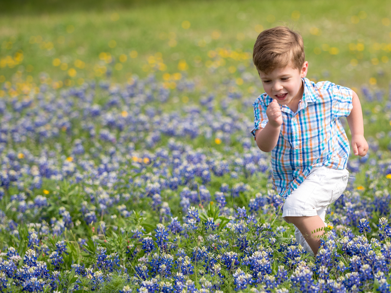 child playing a field after receiving treatment for Legg-Calve-Perthes disease