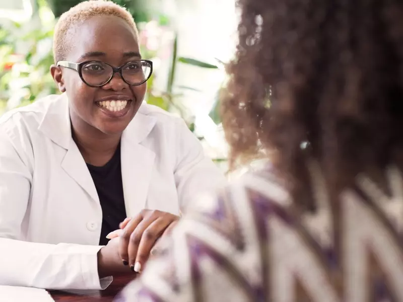 doctor discussing a barium enema with a patient