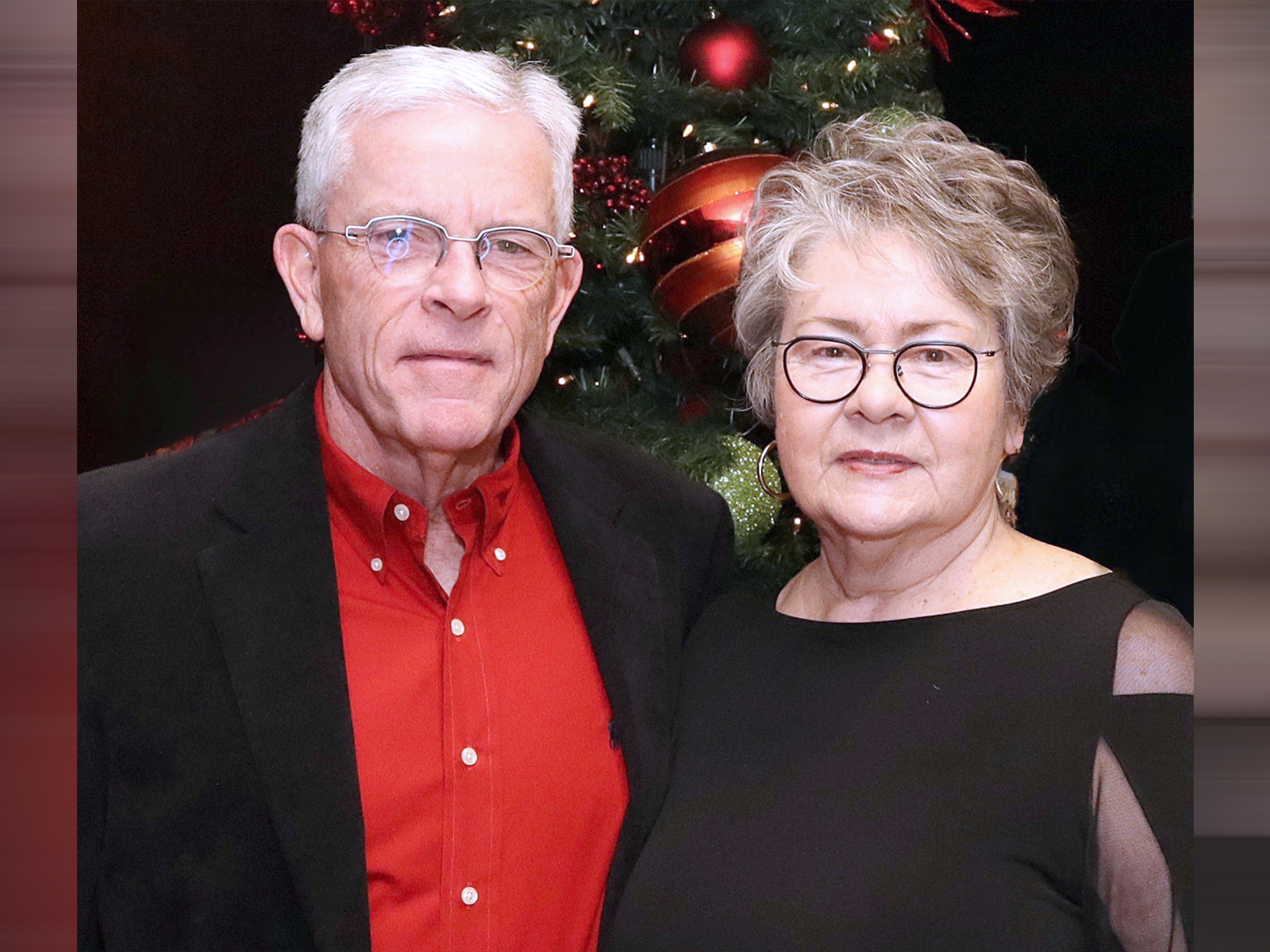 Gary and Deana Gobles stand together at a Christmas party after undergoing surgery at Baylor Scott 