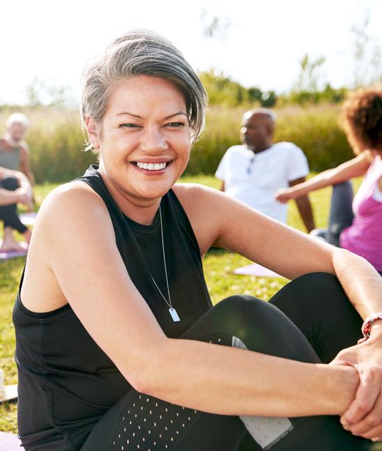 woman attending a cardiac and pulmonary rehabilitation event outside on a sunny day