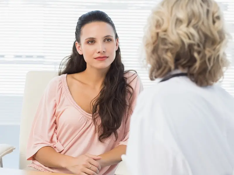 patient listening intently to her provider talking about cystoplasty outcomes