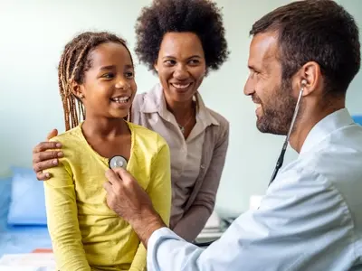 A family speaking to a doctor in an urgent care 