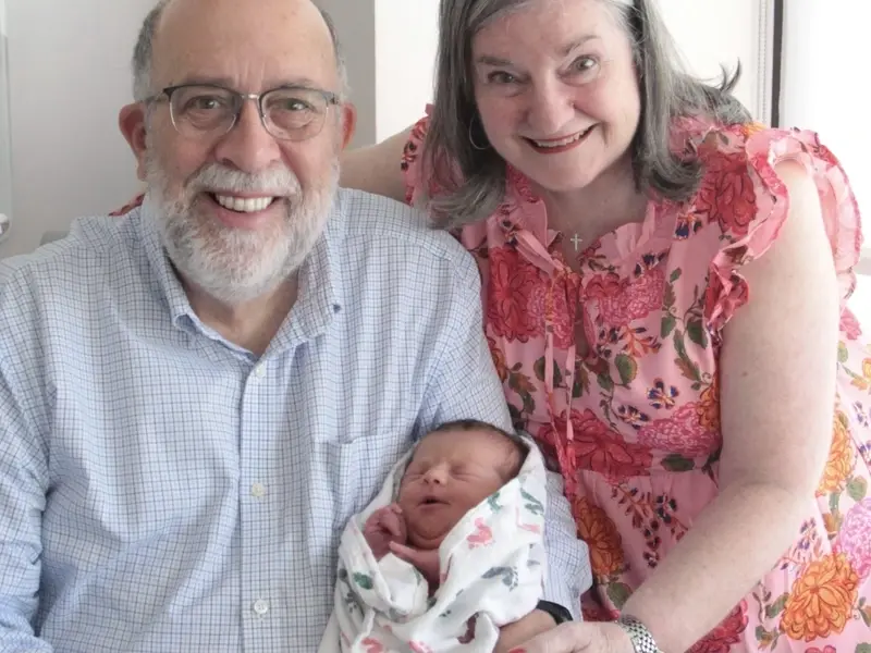 Luke and Paula with newborn grandchild.jpg