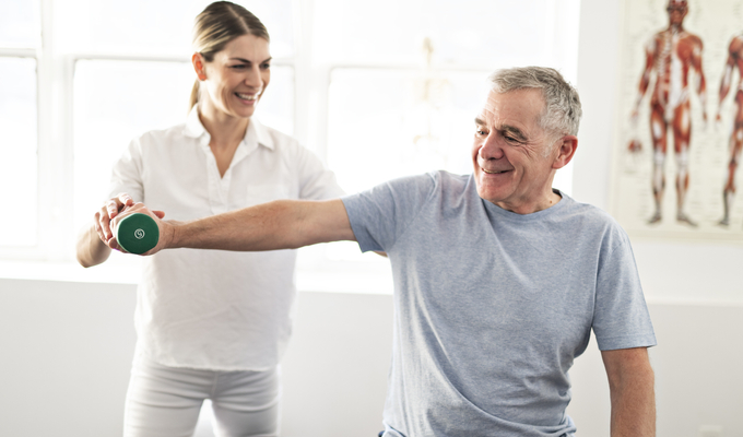 Older man getting physical therapy