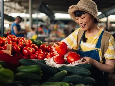 A woman buying healthy food to reduce triglycerides.jpeg