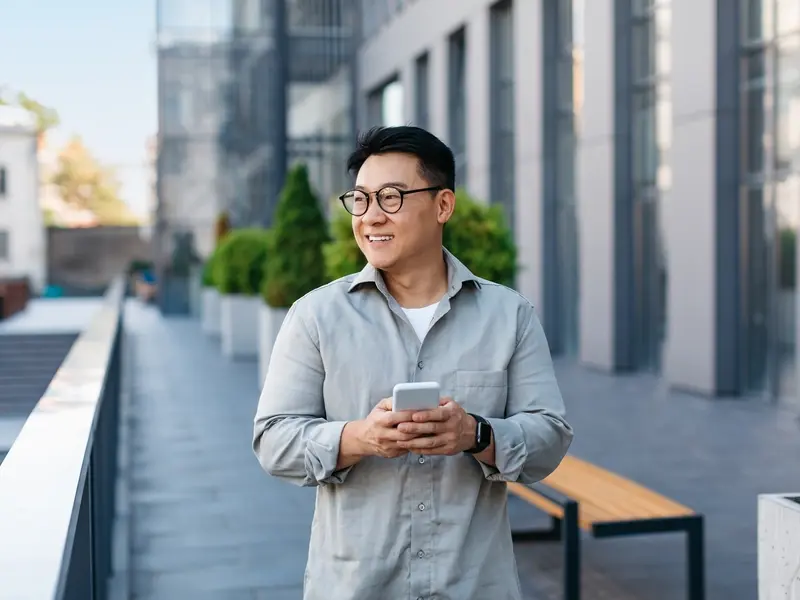 Man walking with phone on the street