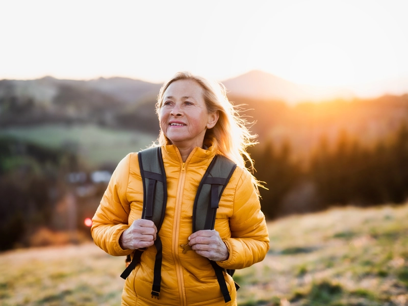 Woman hiking on a sunny morning post-orthopedic surgery in Brenham, Texas