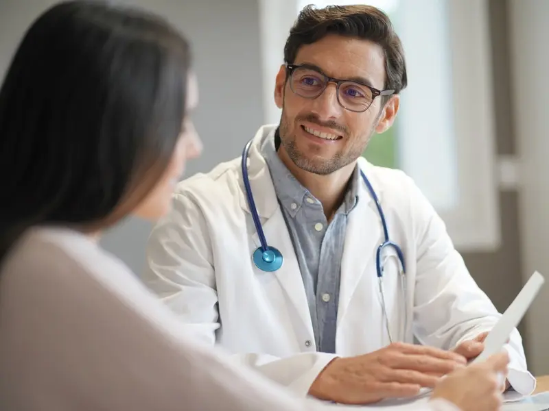 doctor discussing TMS treatment results with a patient