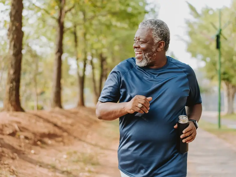 man walking outside after recovering from hip replacement surgery