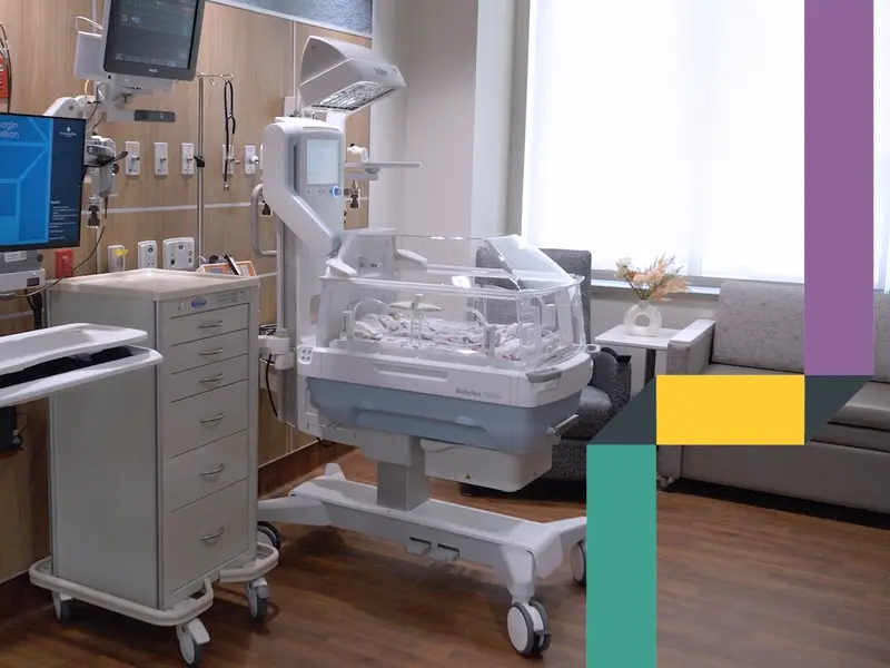 NICU baby in isolette