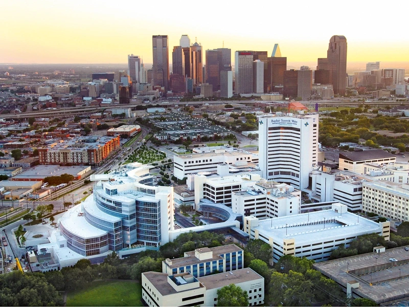 Overhead view of the medical campus of Baylor University Medical Center, part of Baylor Scott & White Health with Downtown Dallas in the background