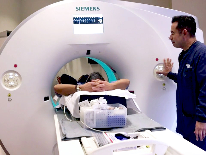 patient receiving a CT scan to look for calcium deposits