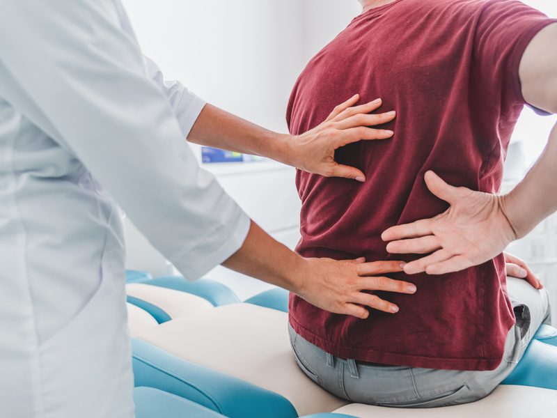 doctor discussing the risks of laminectomy surgery with a patient