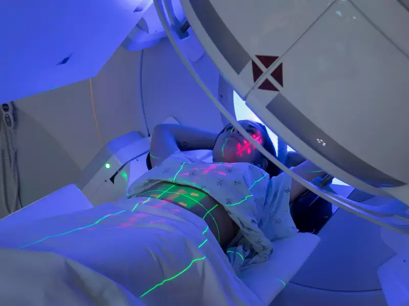  Young woman lying in an MRI machine undergoing a diagnostic scan for a potential brain tumor.
